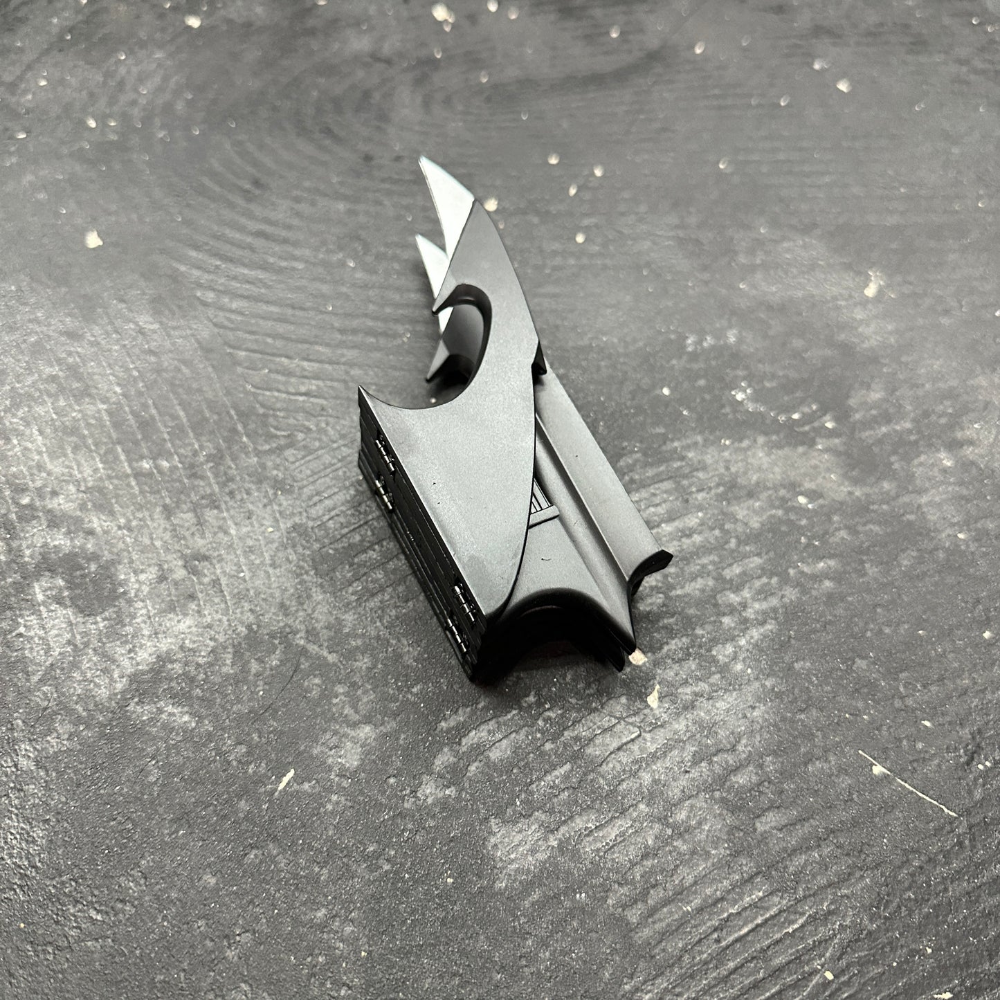 NECA BATMAN 1989 Folding Magnetic Batarang (LOOSE) displayed on a textured surface.