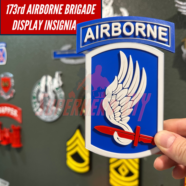 173rd Airborne Brigade display insignia featuring a winged design with a red sword, perfect for unit pride.