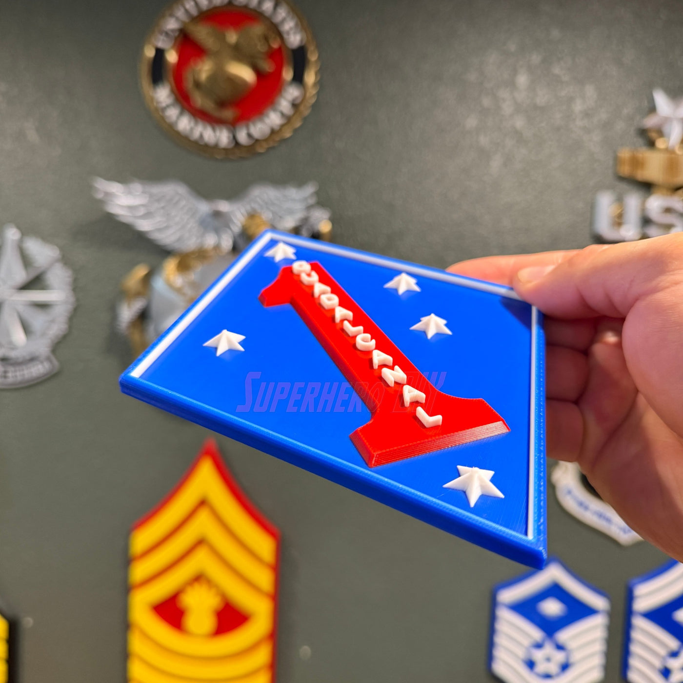 1st Marine Division Display Insignia in layered relief with blue diamond and red numeral one.