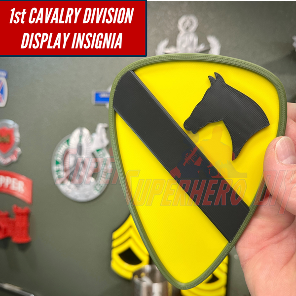 1st Cavalry Division Display Insignia in hand near various military decor items.