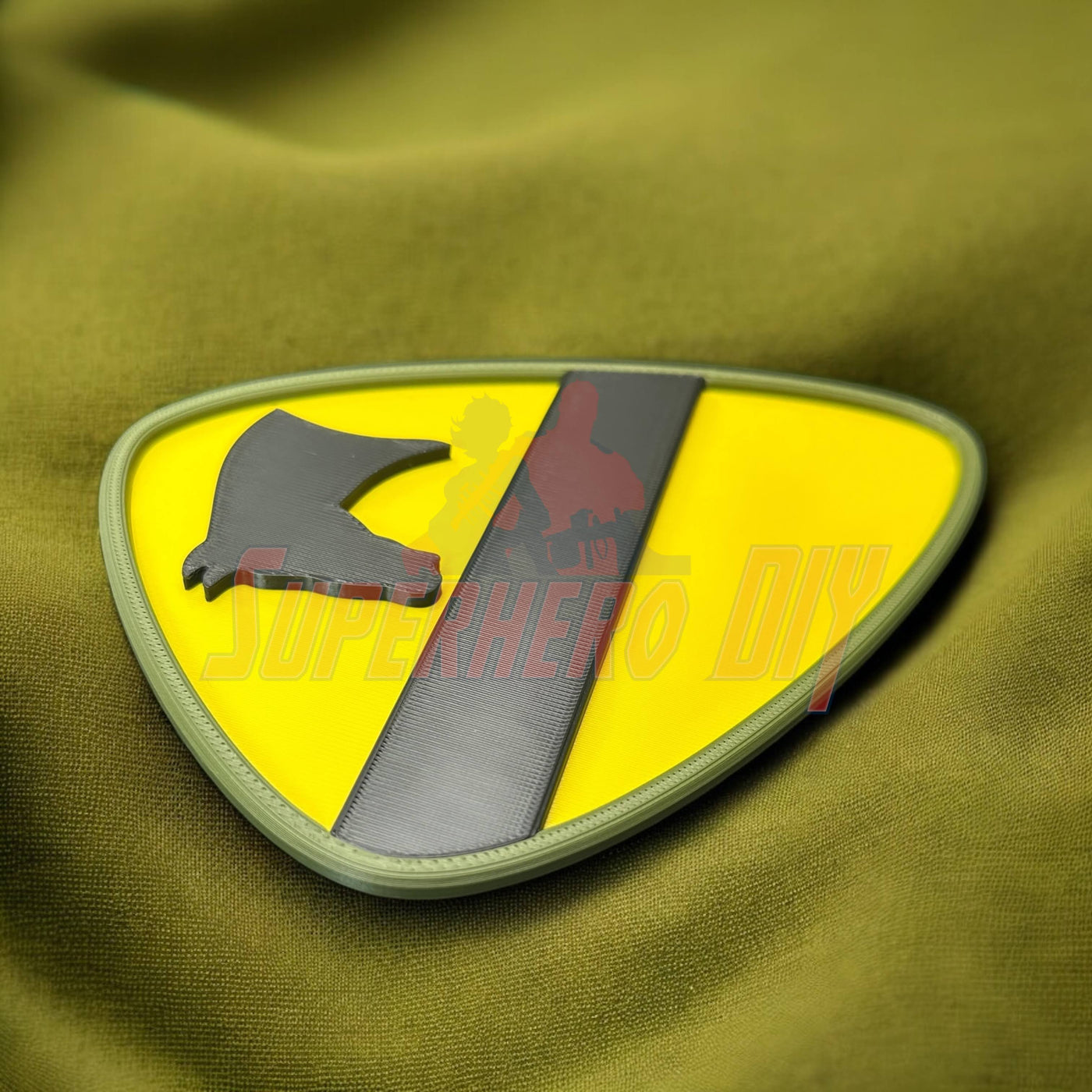 1st Cavalry Division Display Insignia on green fabric, perfect military decor piece for shop or game room.
