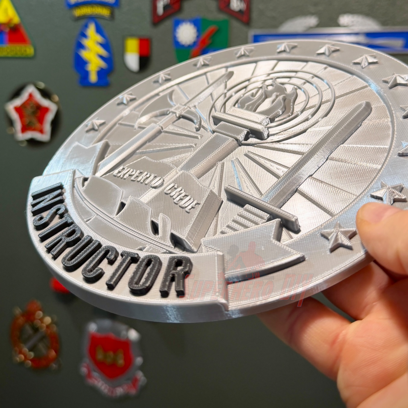 Army Instructor Badge display showing 3D metal insignia held in hand, ideal for shadow box or wall display.