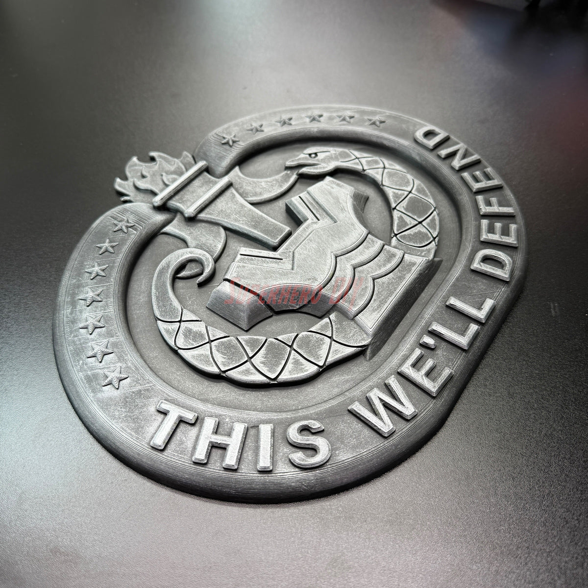 Drill Sergeant Badge insignia featuring the motto 'THIS WE'LL DEFEND' displayed in a detailed 3D design.