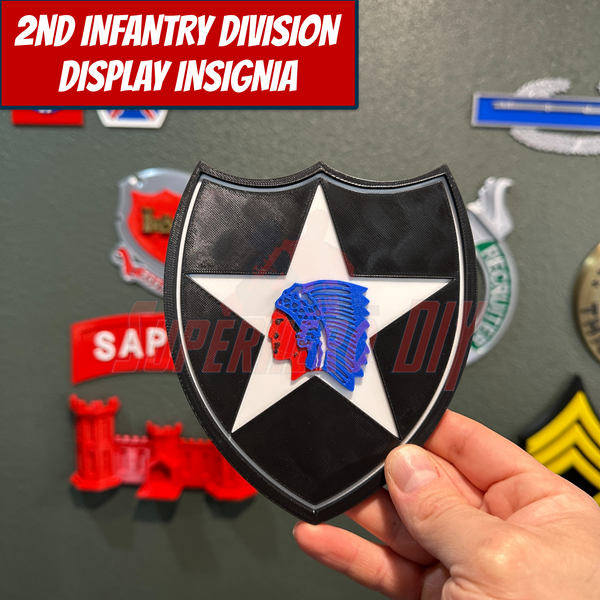 2nd Infantry Division display insignia patch held against a backdrop of other military insignias, available in multiple sizes for display.
