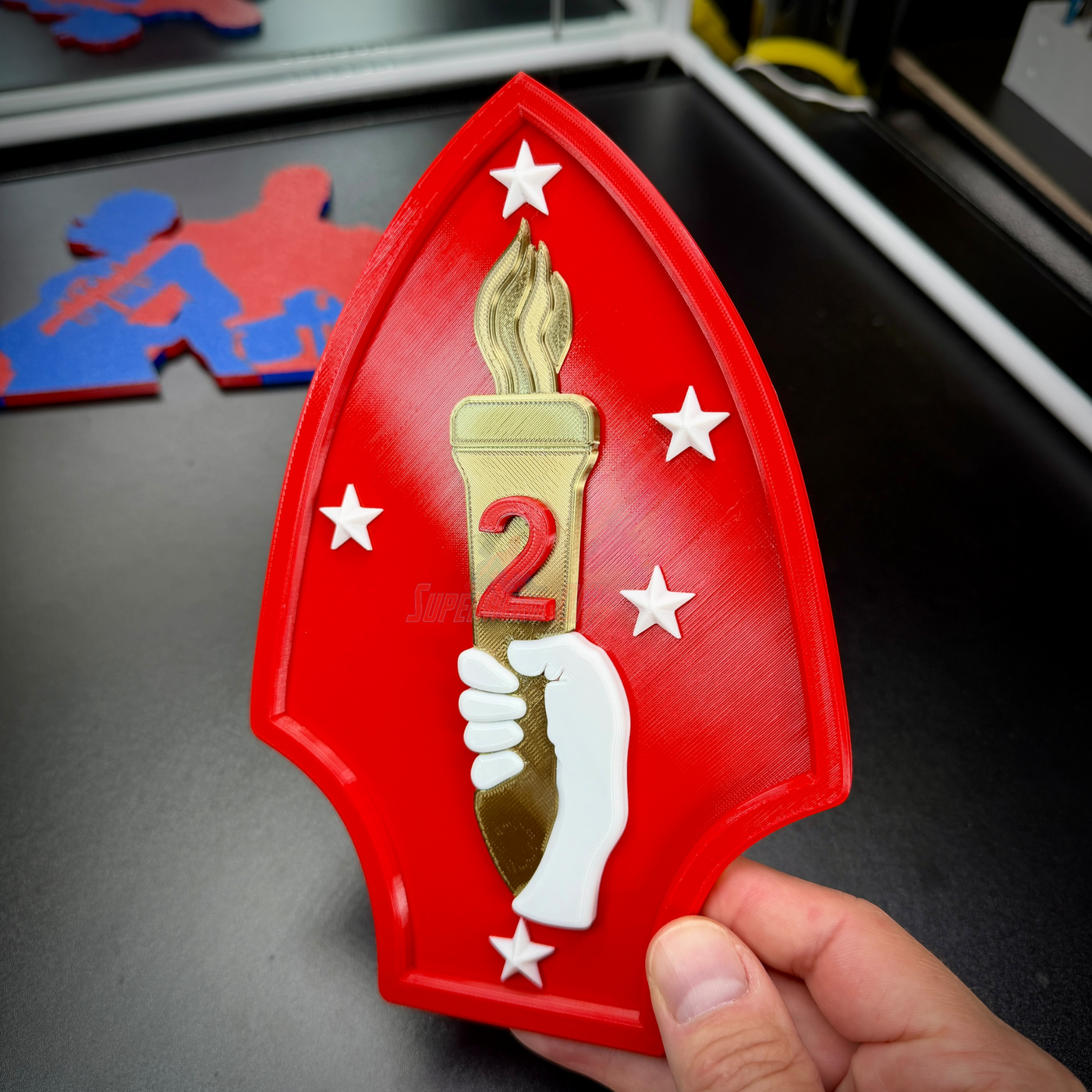 2nd Marine Division display insignia featuring scarlet spearhead and gold torch, perfect for wall or shadow box display.