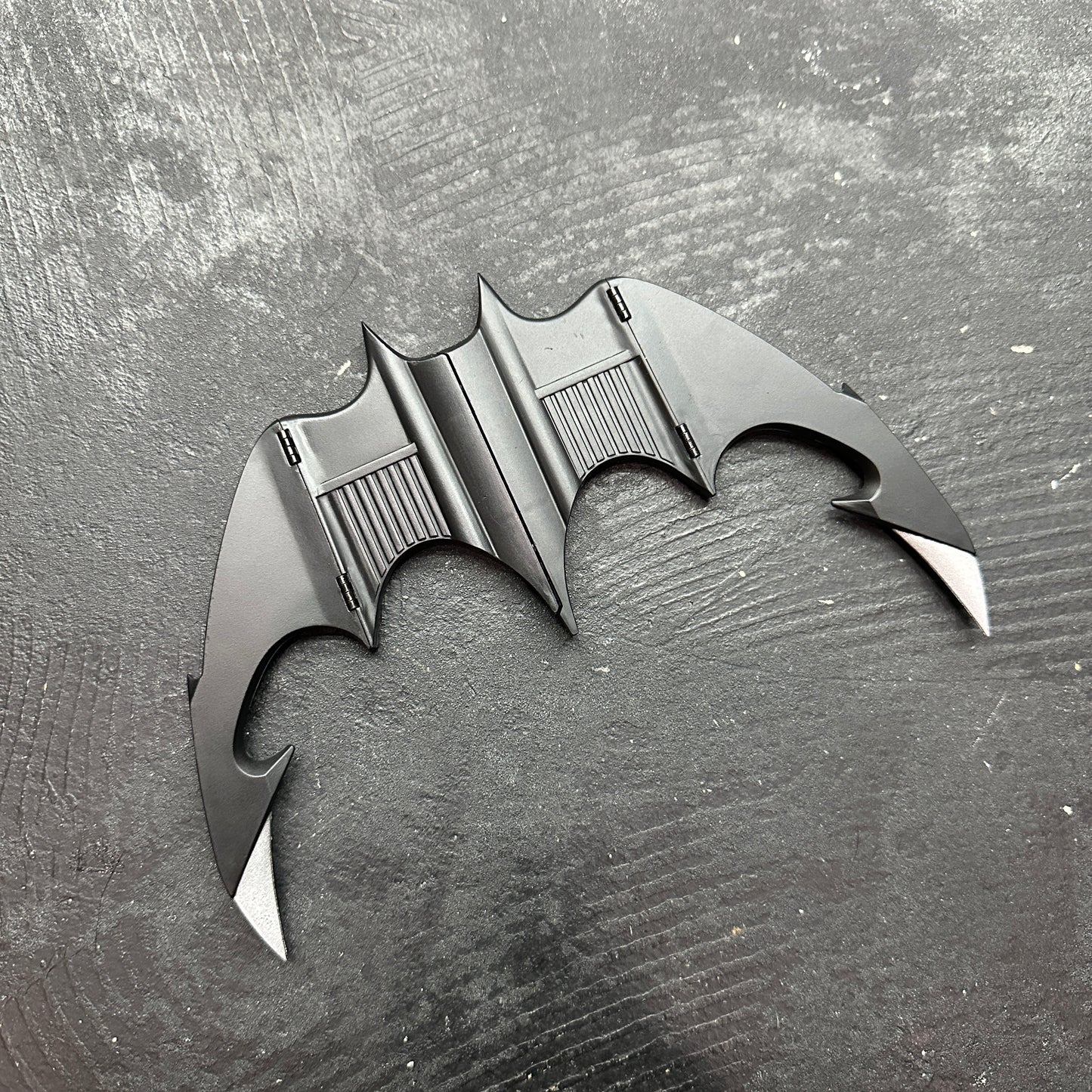 NECA BATMAN 1989 Folding Magnetic Batarang (LOOSE) displayed on a dark background.