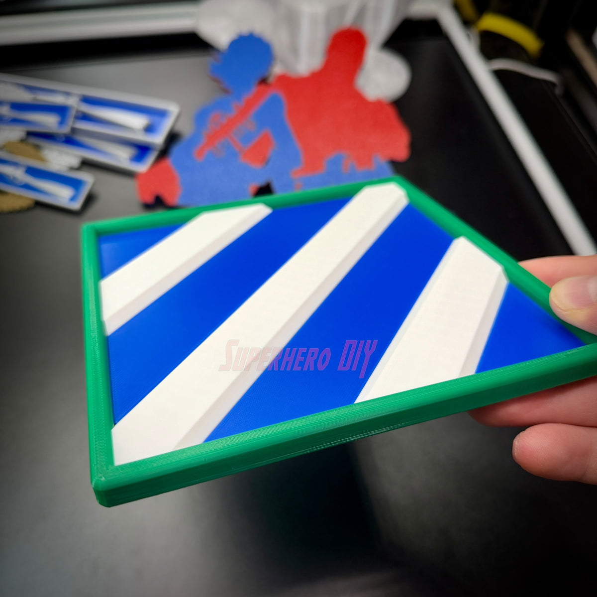 3rd Infantry Division display insignia patch with blue and white design held in hand.
