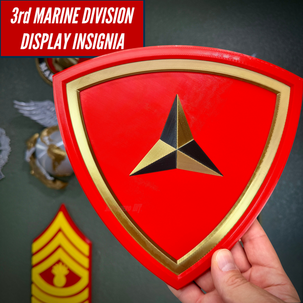 3rd Marine Division display insignia with scarlet shield and gold border, showcasing layered design and symbolic caltrap.