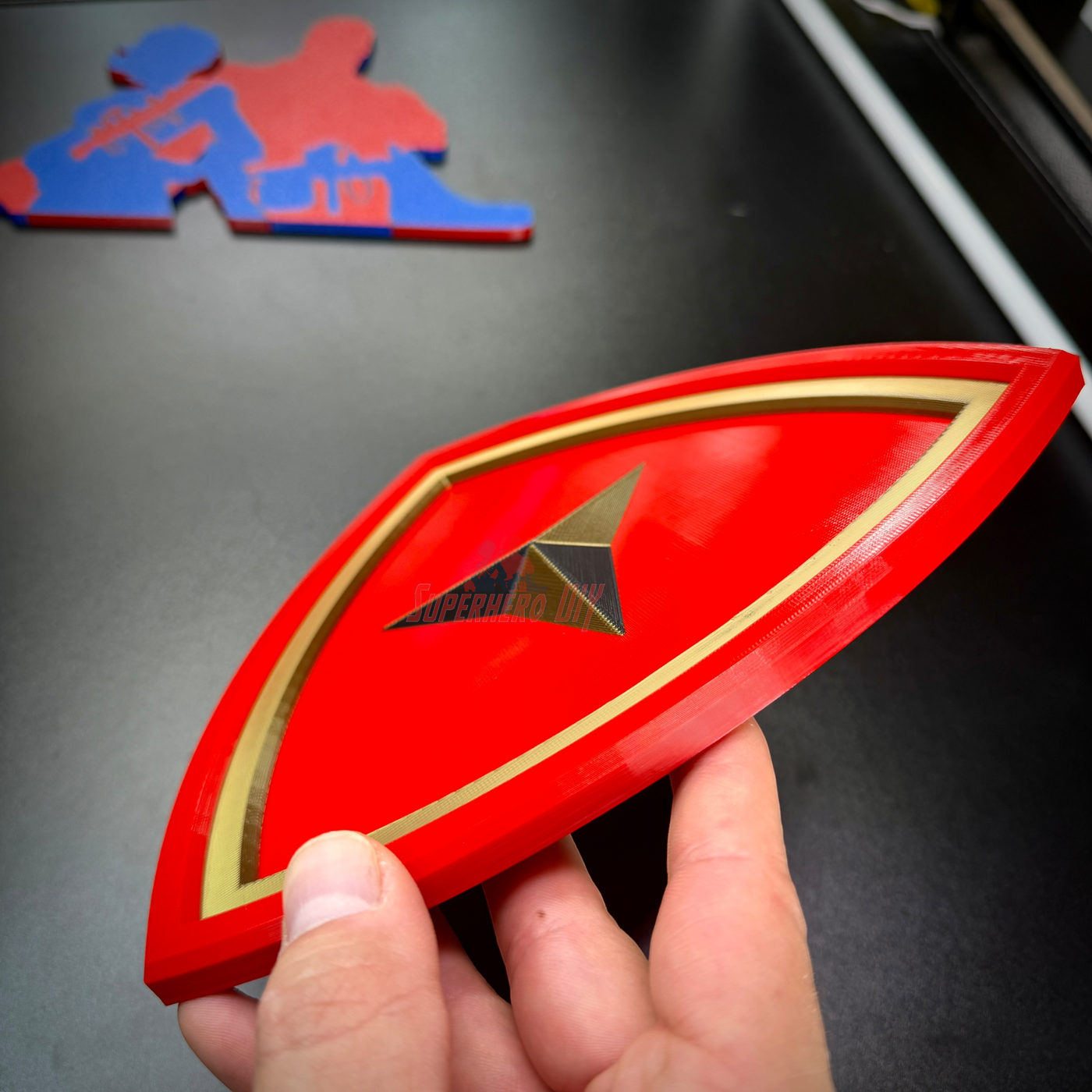3rd Marine Division insignia with gold border held in hand, showcasing layered relief design.