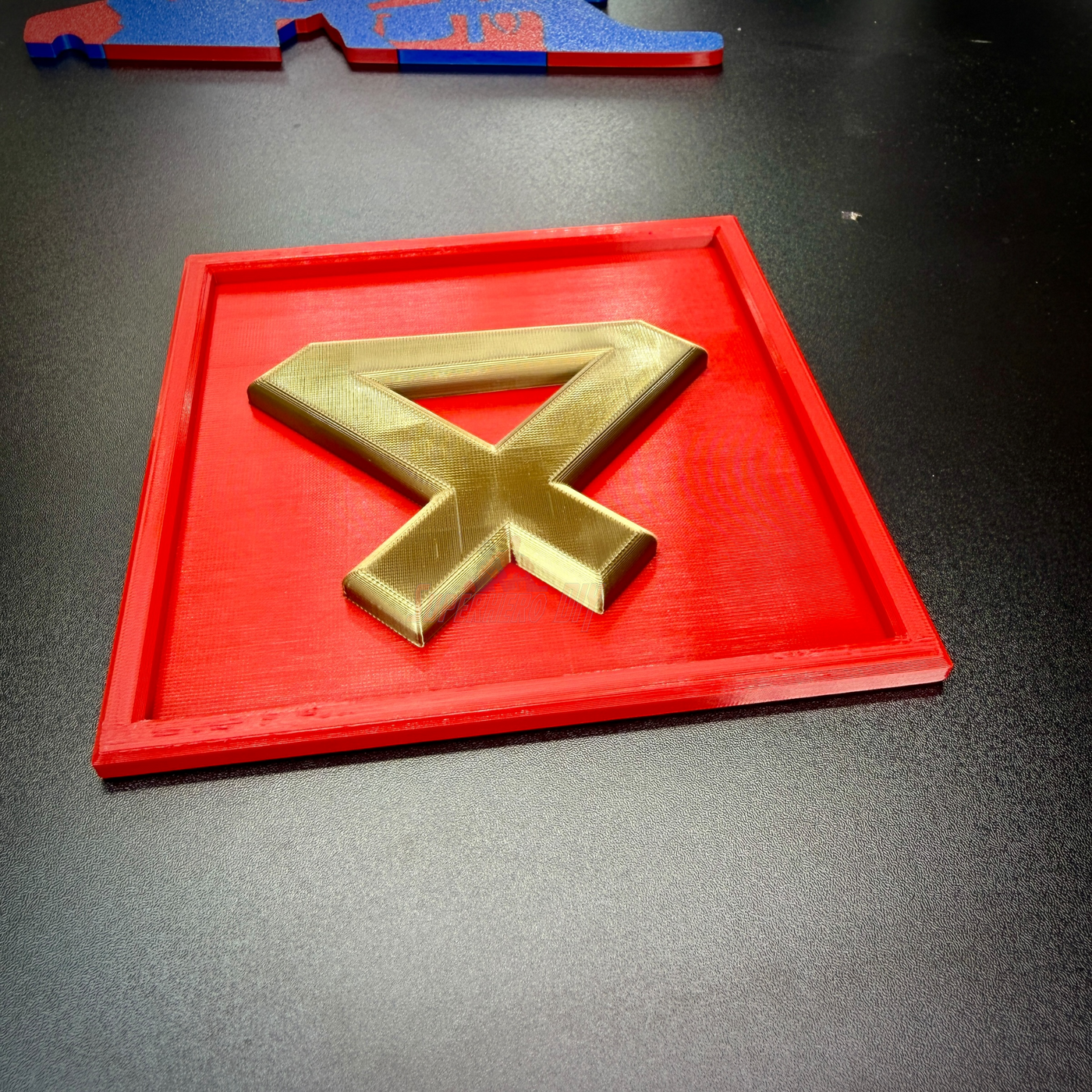 4th Marine Division insignia in gold layered relief displayed on a red background, perfect for shadow box or wall mount.