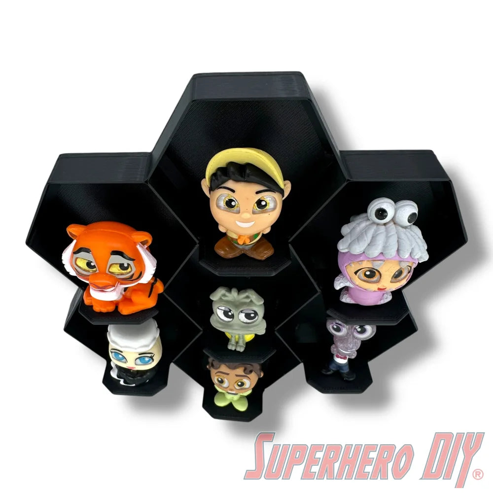 Wall-mounted honeycomb shelf for Disney Doorables, holds 7 figures with foot pegs for stable and organized display