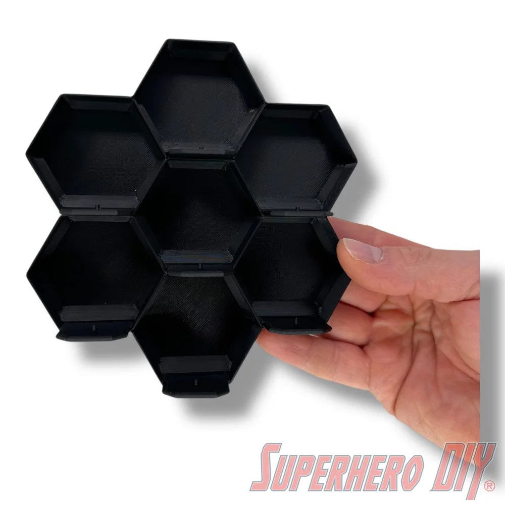 Wall-mounted honeycomb shelf for Disney Doorables, holds 7 figures with foot pegs for stable and organized display