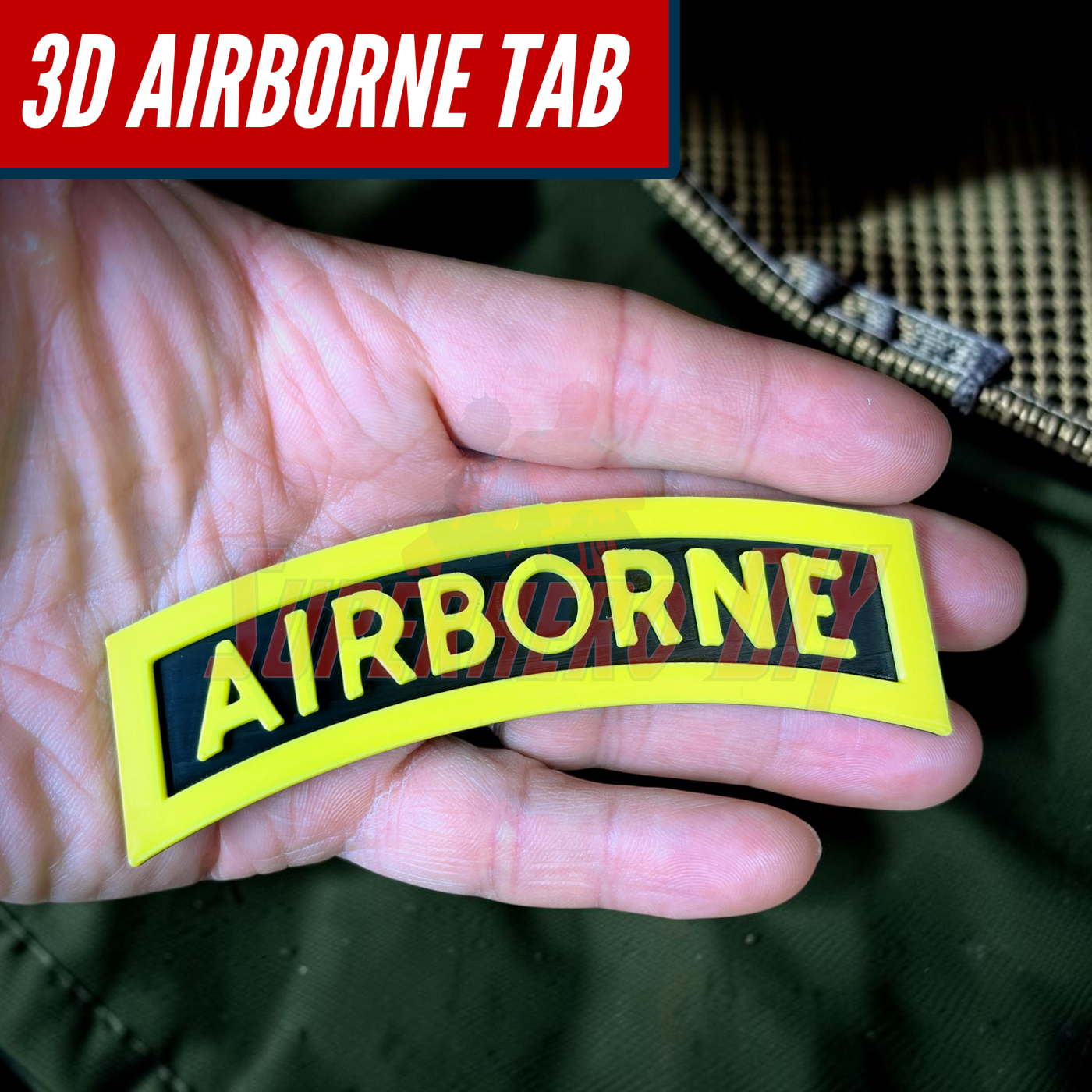 3D airborne tab resting in a hand, featuring bold yellow lettering on a solid black background.