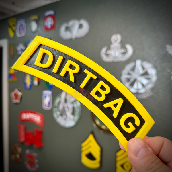 DIRTBAG tab display in classic Army tab style, black and yellow, perfect gag gift for soldiers and battle buddies.