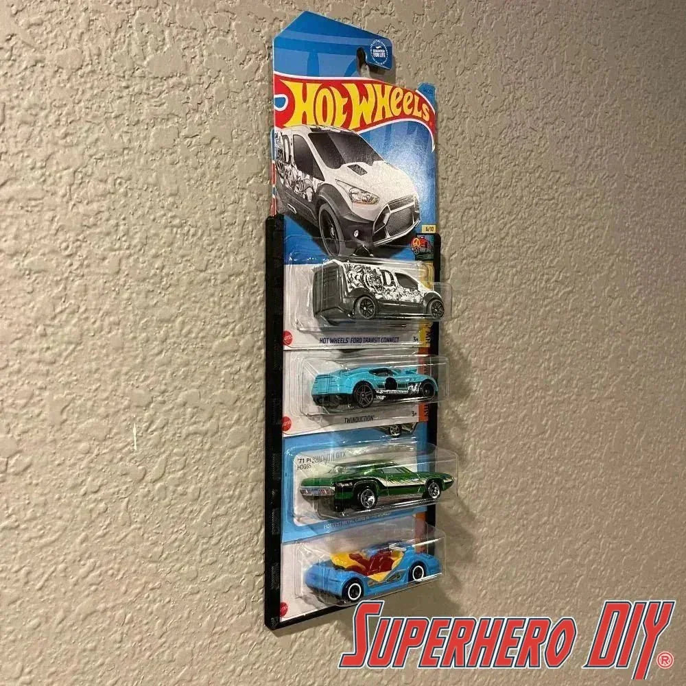 hot wheels wall display sleeve showing 5 blister-packed 1:64 scale cars mounted on a textured wall