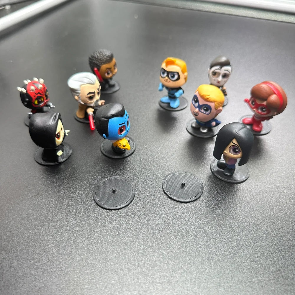 Display Stands for Disney Doorables Figures Peg Bases to Keep Standing with figures arranged on bases.