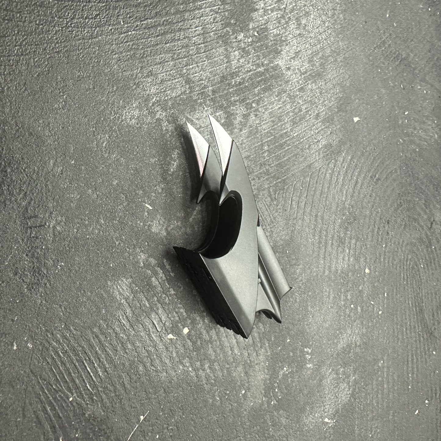 NECA BATMAN 1989 Folding Magnetic Batarang (LOOSE) displayed on a textured black surface.