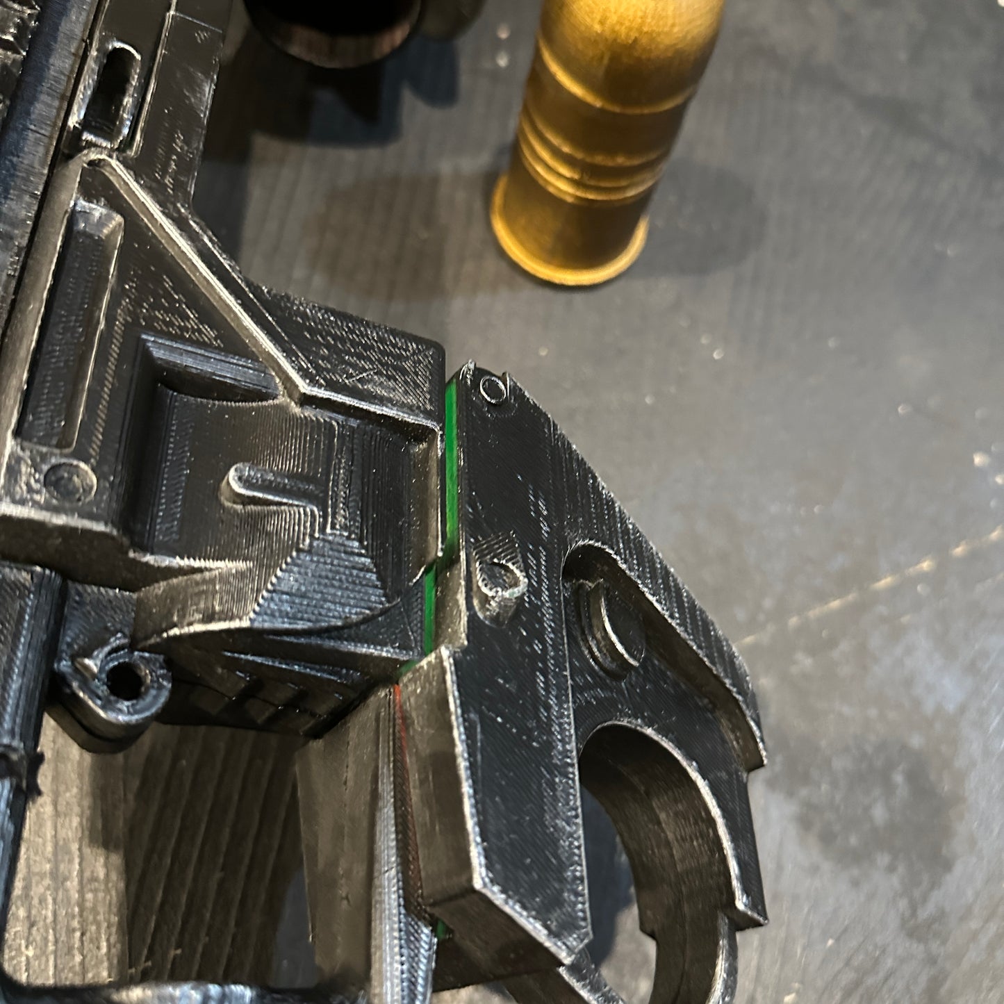 Close-up of BvS Grenade Launcher Prop Batman v Superman showing detail and removable grenade.