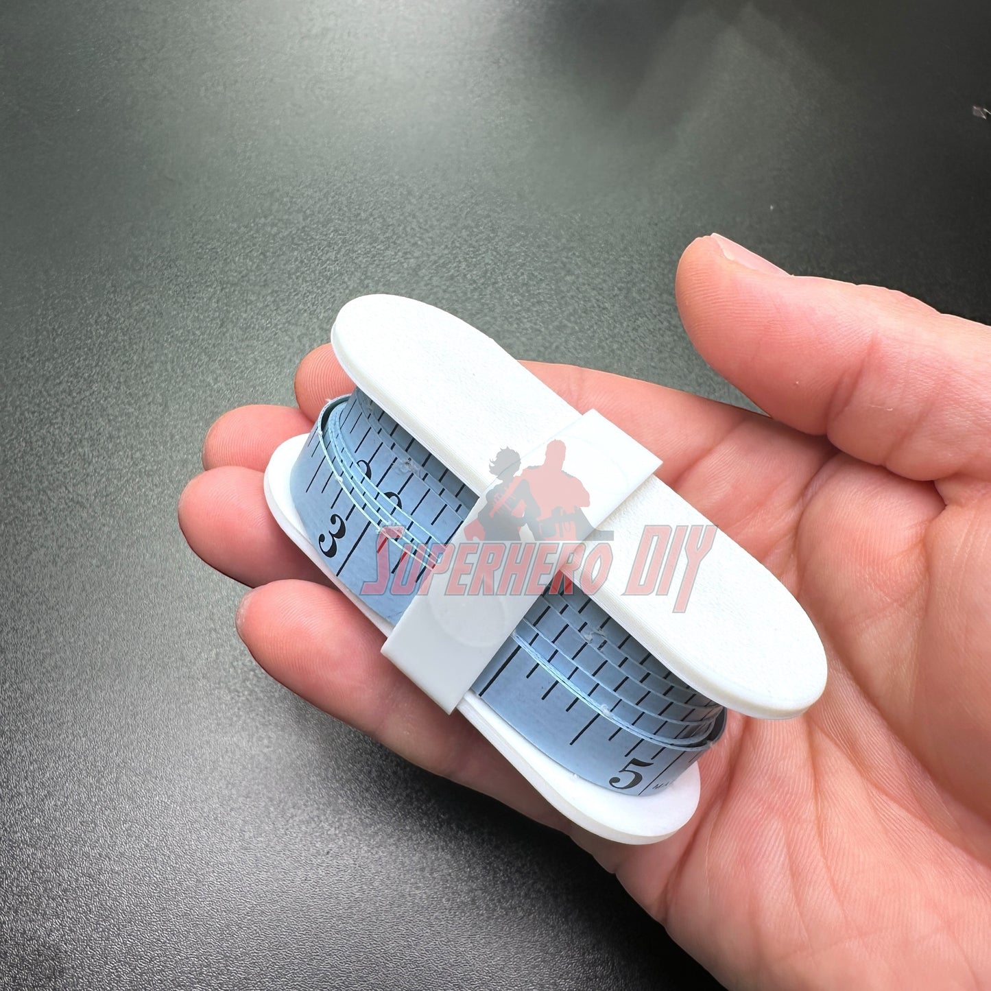 Fabric Tape Measure Holder | Snap-On Sewing Tape Storage for 60" or 145" Tailor’s Tapes in hand, easy to use sewing tool.