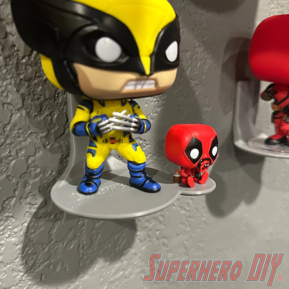Display shelf for Funko Pop & Buddy showcasing collectible figures on wall-mounted shelf.