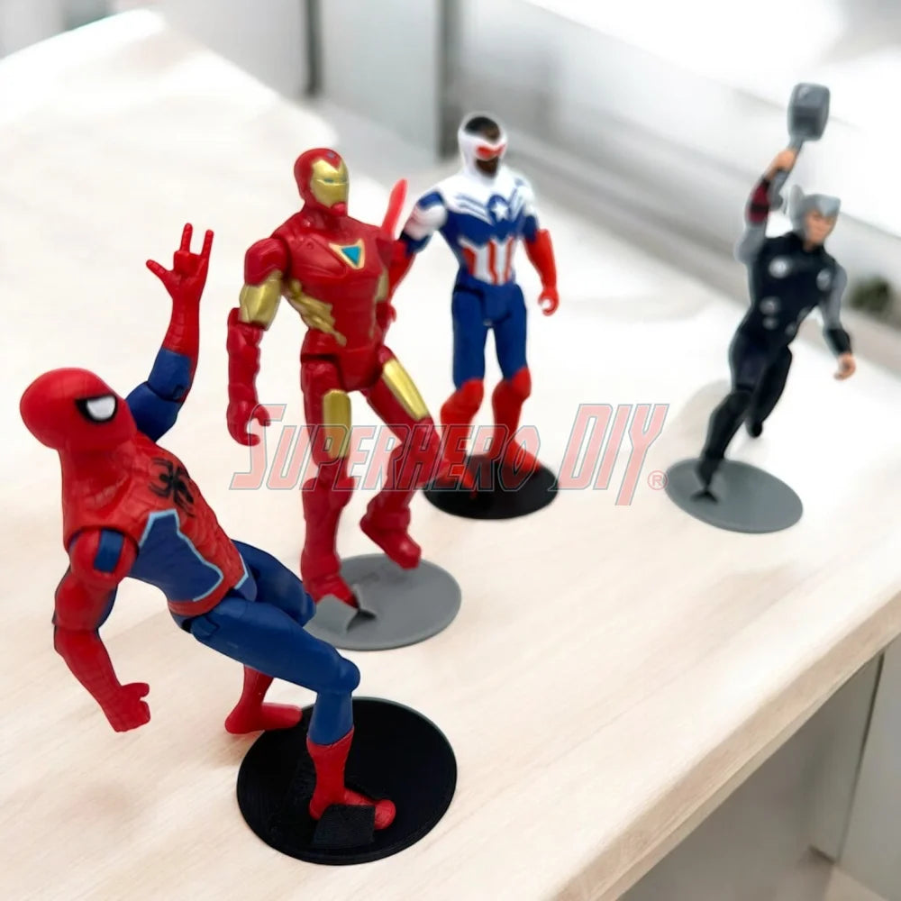 Foot Stands for 3.75-in to 4-in Action Figures holding superhero figures on a desk, ideal for 1:18 scale collectibles stability.