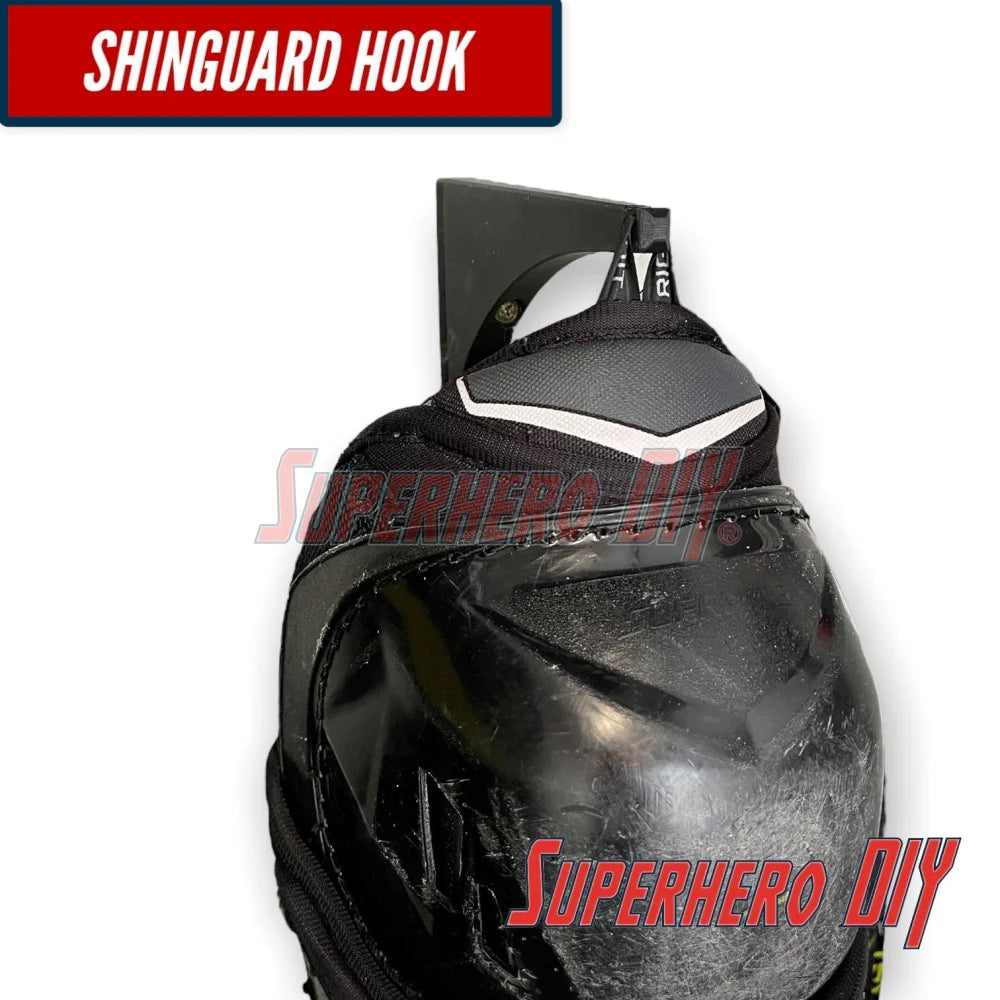 Shinguard hook for wall-mounted hockey gear organizer ensuring easy access and organization of hockey equipment.