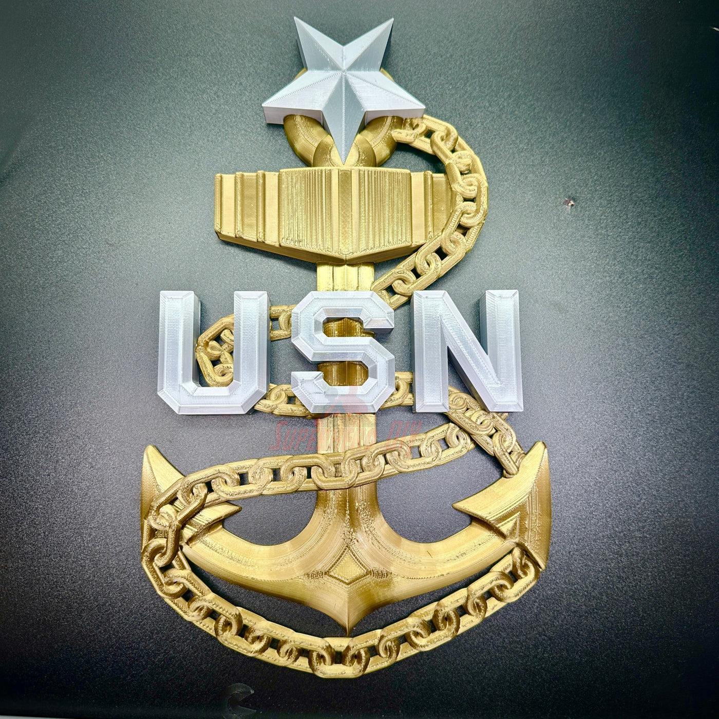 Navy enlisted rate insignia design featuring USN letters with anchor and star on black background.