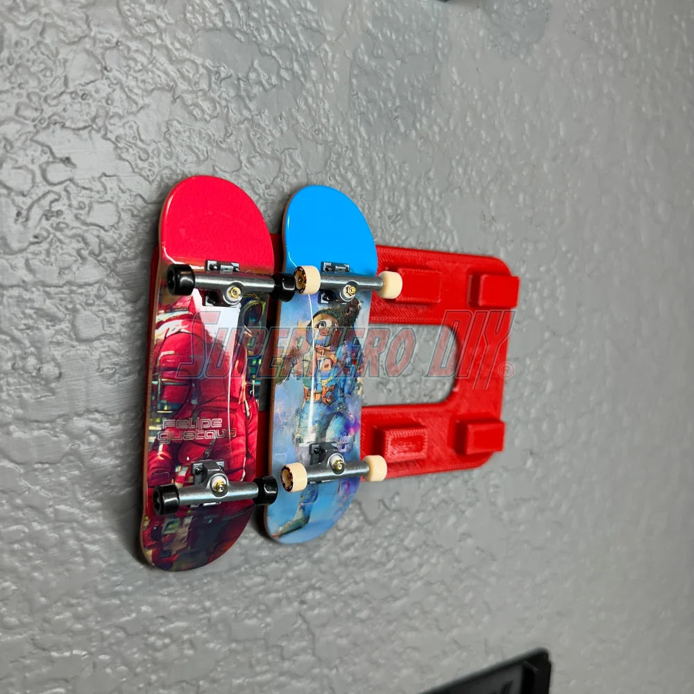 Magnetic Tech Deck wall mount displaying fingerboards on a textured wall surface.