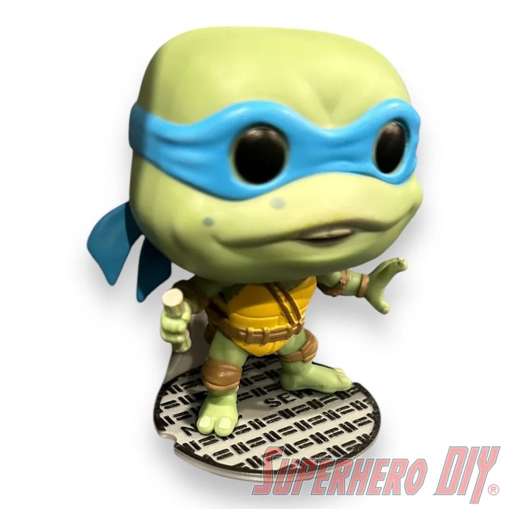 Floating shelf designed to display TMNT action figures and collectibles, styled like a sewer manhole cover for themed wall display