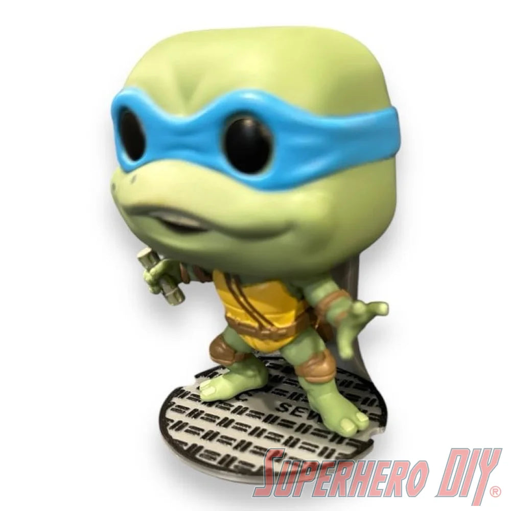 Floating shelf designed to display TMNT action figures and collectibles, styled like a sewer manhole cover for themed wall display