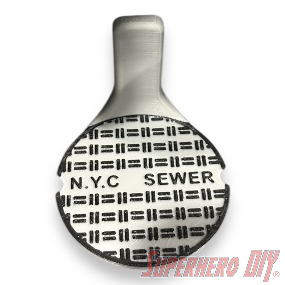 Floating shelf designed to display TMNT action figures and collectibles, styled like a sewer manhole cover for themed wall display