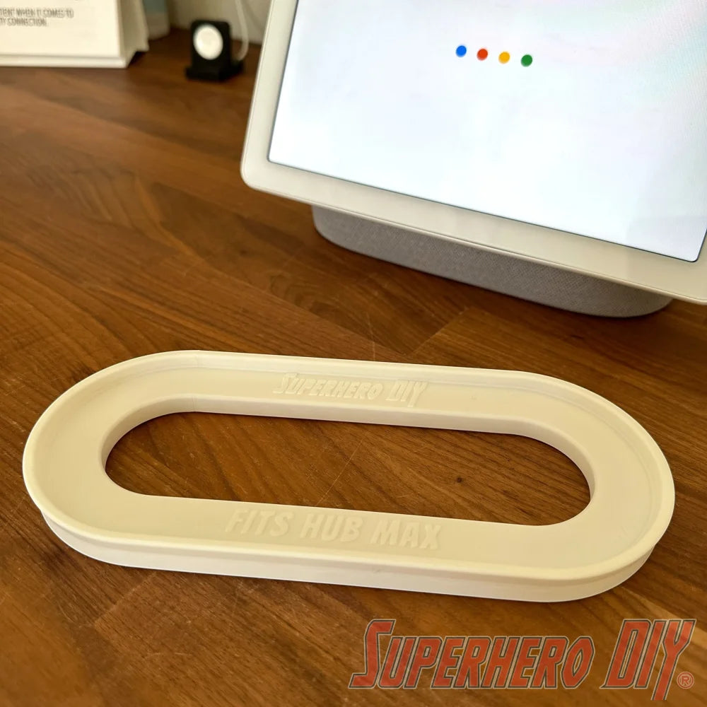 Google Nest Hub Max riser stand on wooden countertop in front of smart display, designed to prevent water damage in kitchens and bathrooms.