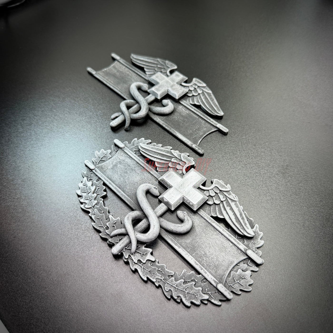 army medical badge display featuring Expert Field Medical Badge and Combat Medical Badge on a dark background.