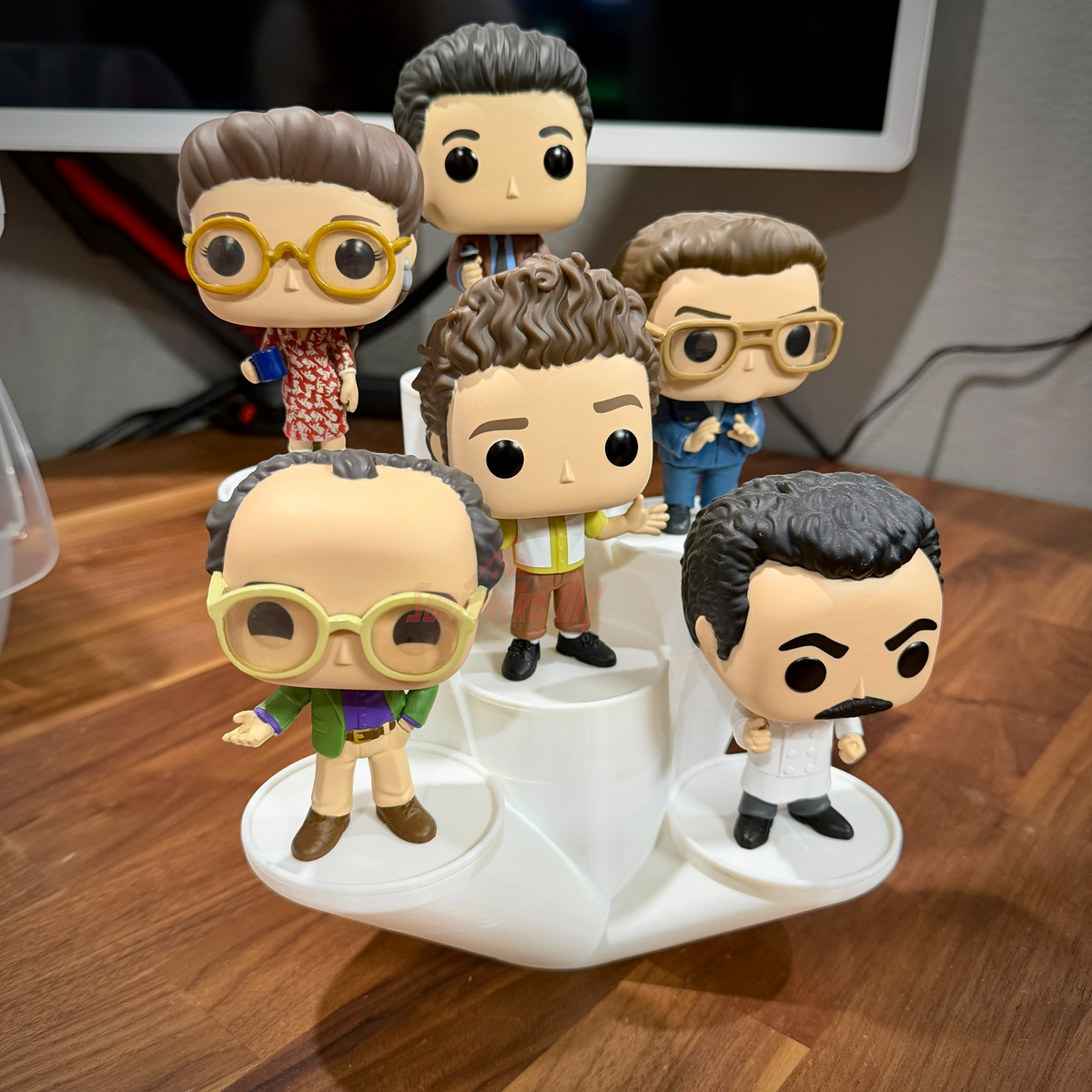 Tiered Funko Pop display stand with six staggered round platforms branching from one base
