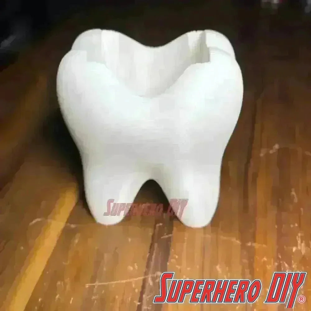 Tooth shaped bathroom organizer, a unique toothbrush holder designed as a tooth for functional and stylish bathroom organization.