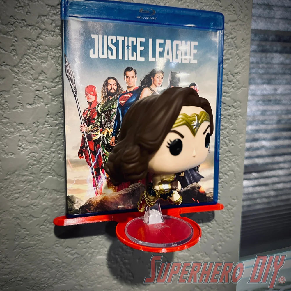 Wall mount media and funko display shelf showing Justice League Blu-ray and Wonder Woman Funko Pop.