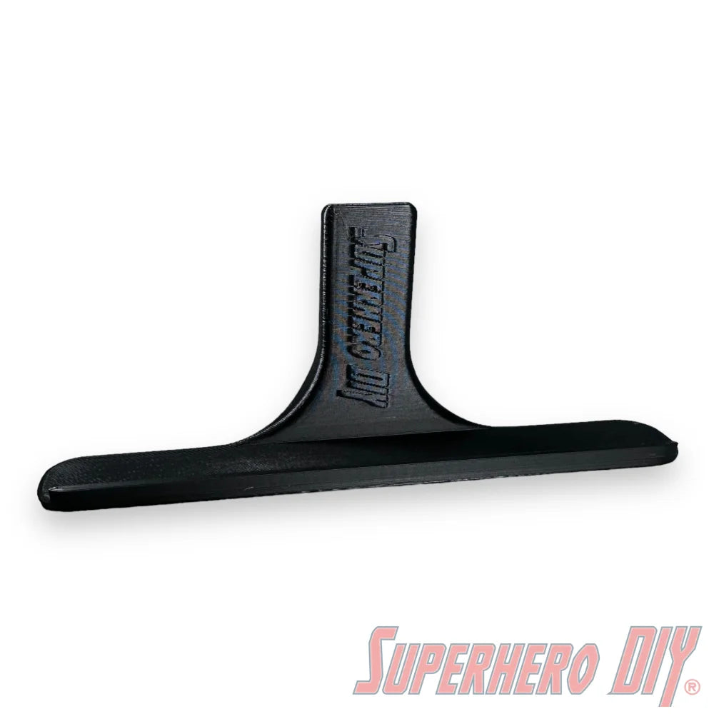 Black floating shelf for movies or video games with the Superhero DIY logo, perfect for displaying Blu-rays or Steelbooks.