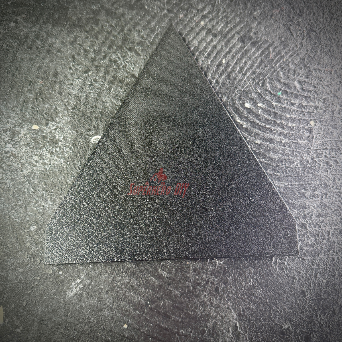 Smooth flat black back of the NTC display insignia, ready for wall mounting