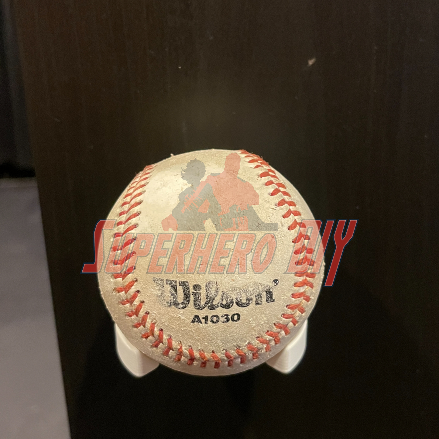 Baseball Holder Wall Mount | Floating Shelf for Baseball Display holding a baseball securely on a dark background
