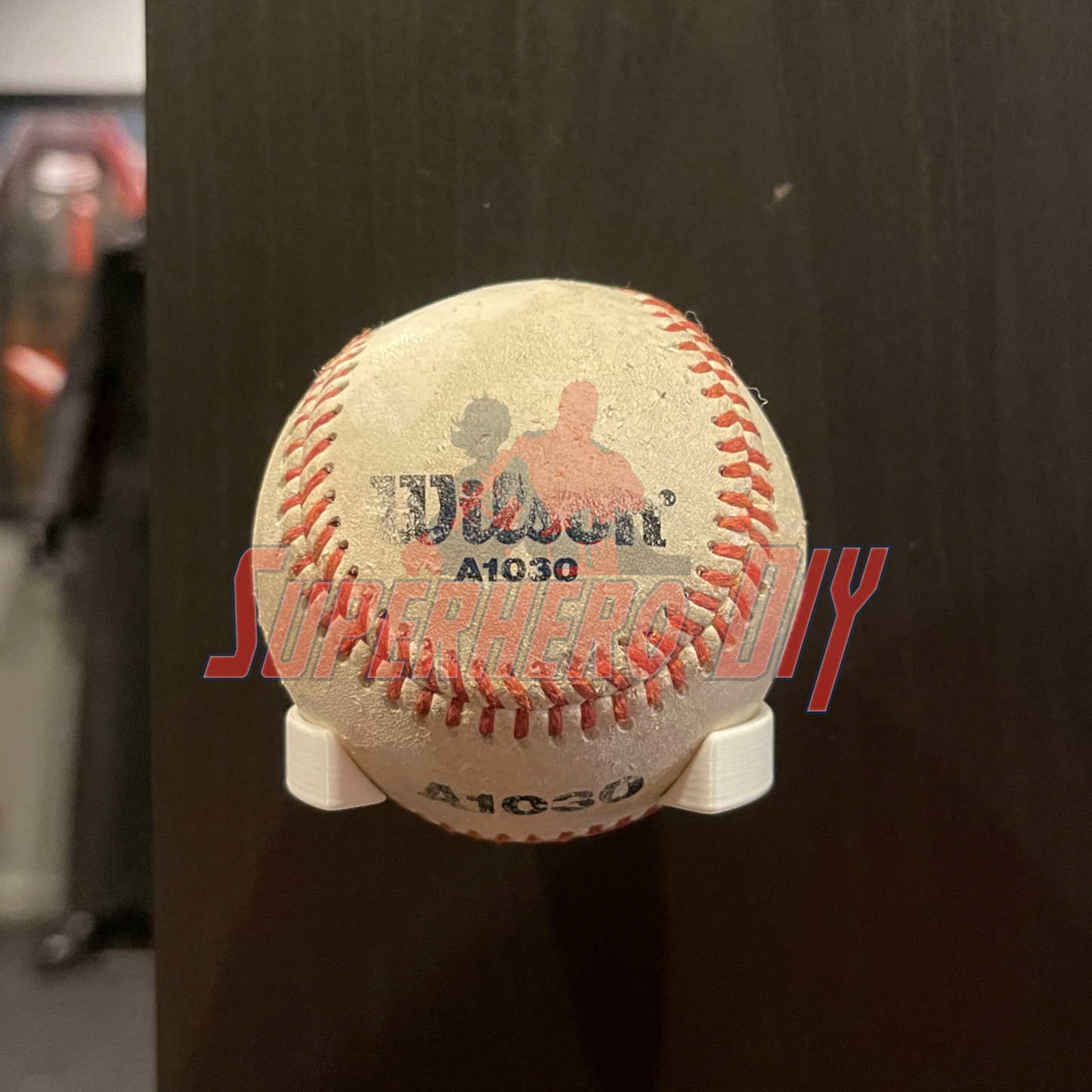 Baseball Holder Wall Mount | Floating Shelf for Baseball Display showcasing a baseball securely mounted on a wall.