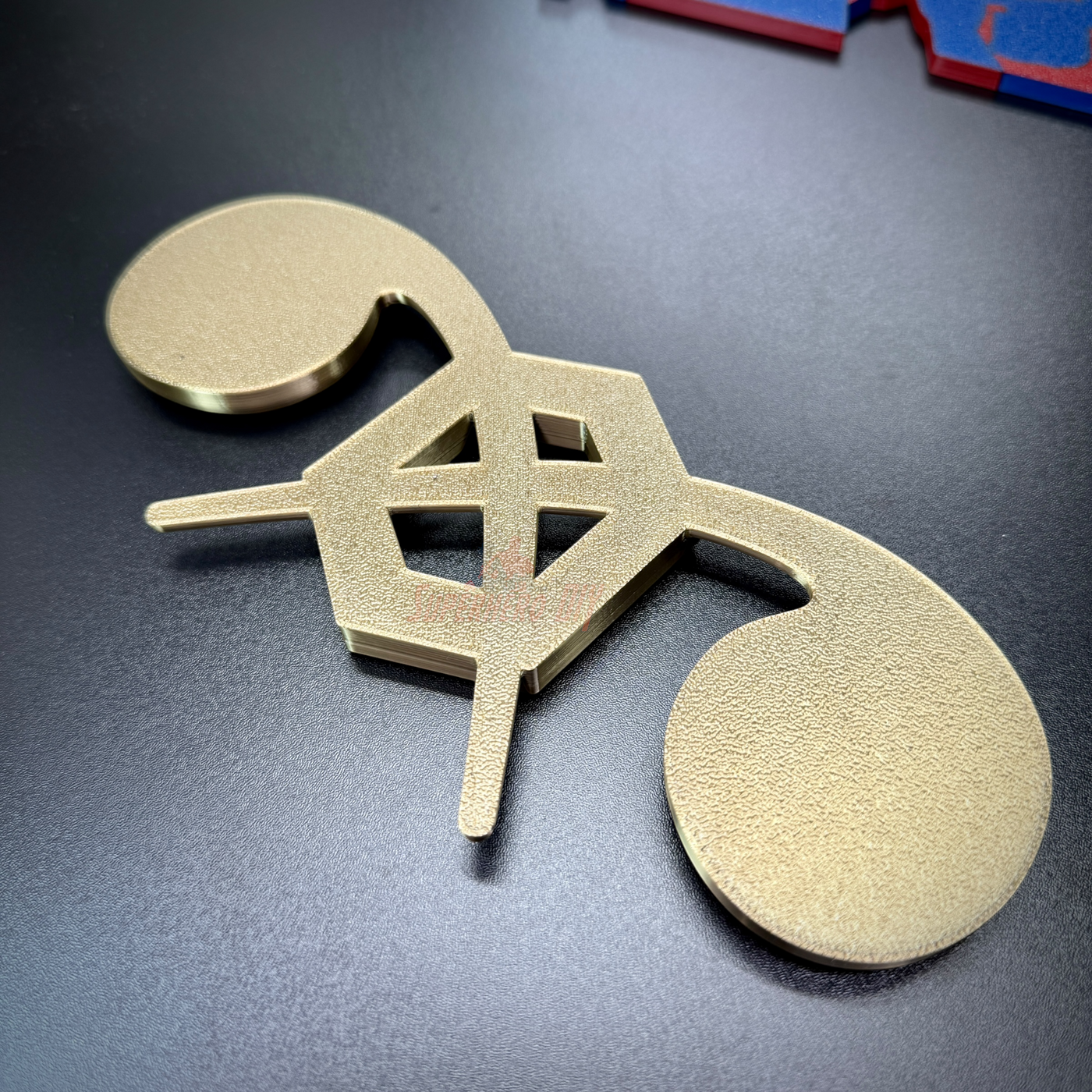 Chemical Corps insignia displayed on a flat surface, showcasing its detailed gold design and craftsmanship.