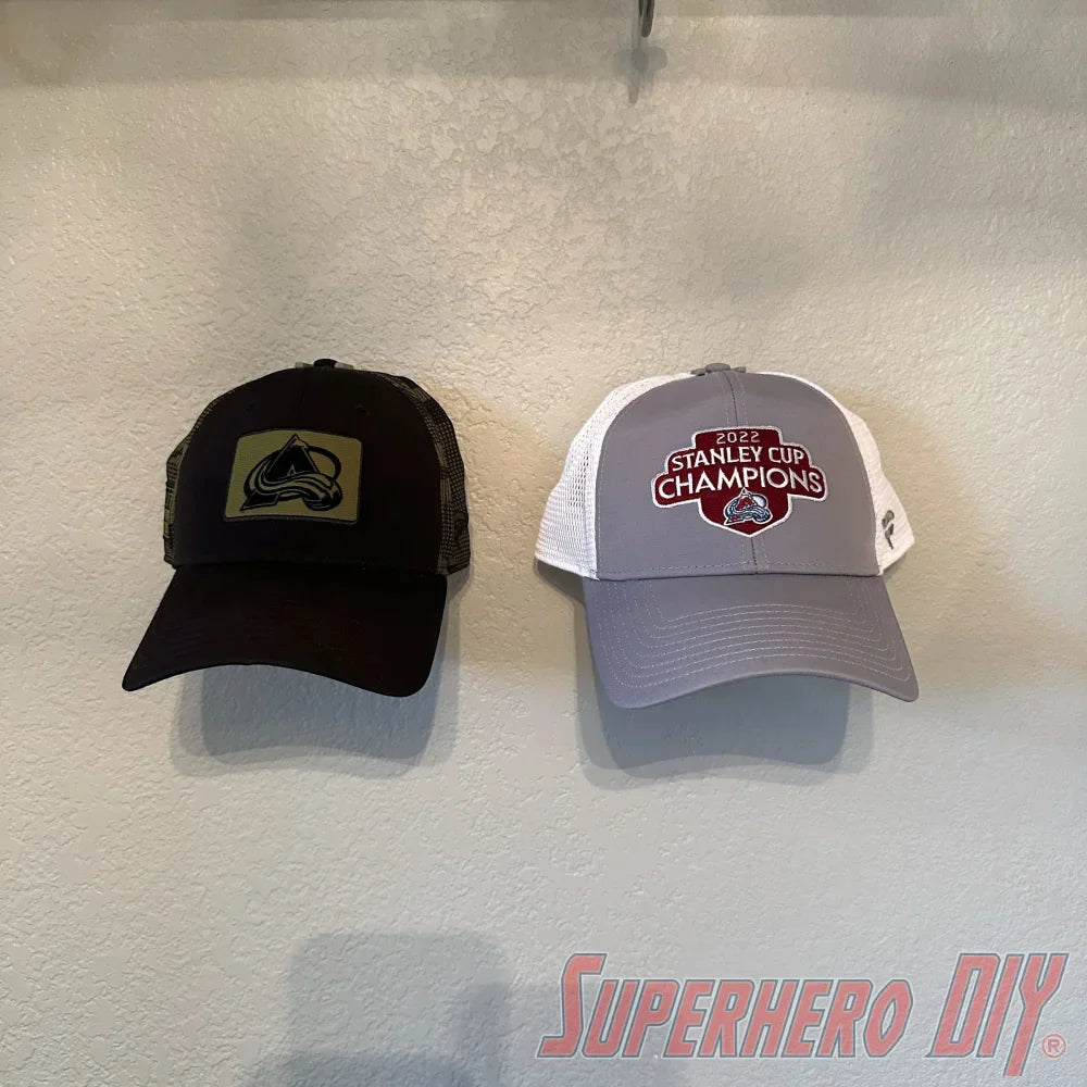 Check out the Hat Display Wall Mount | Hang your caps with ease using these wall hooks! from Superhero DIY! The perfect solution for only $1.99