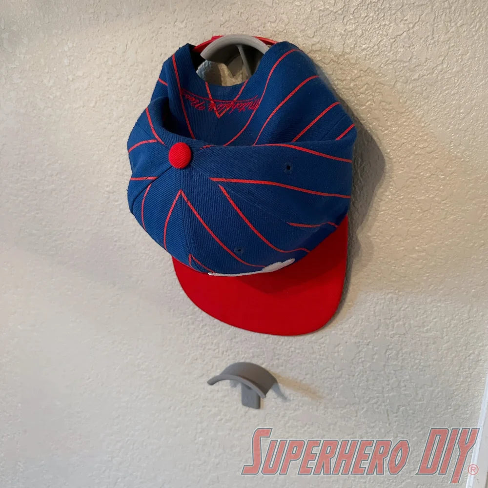 Check out the Hat Display Wall Mount | Hang your caps with ease using these wall hooks! from Superhero DIY! The perfect solution for only $1.99