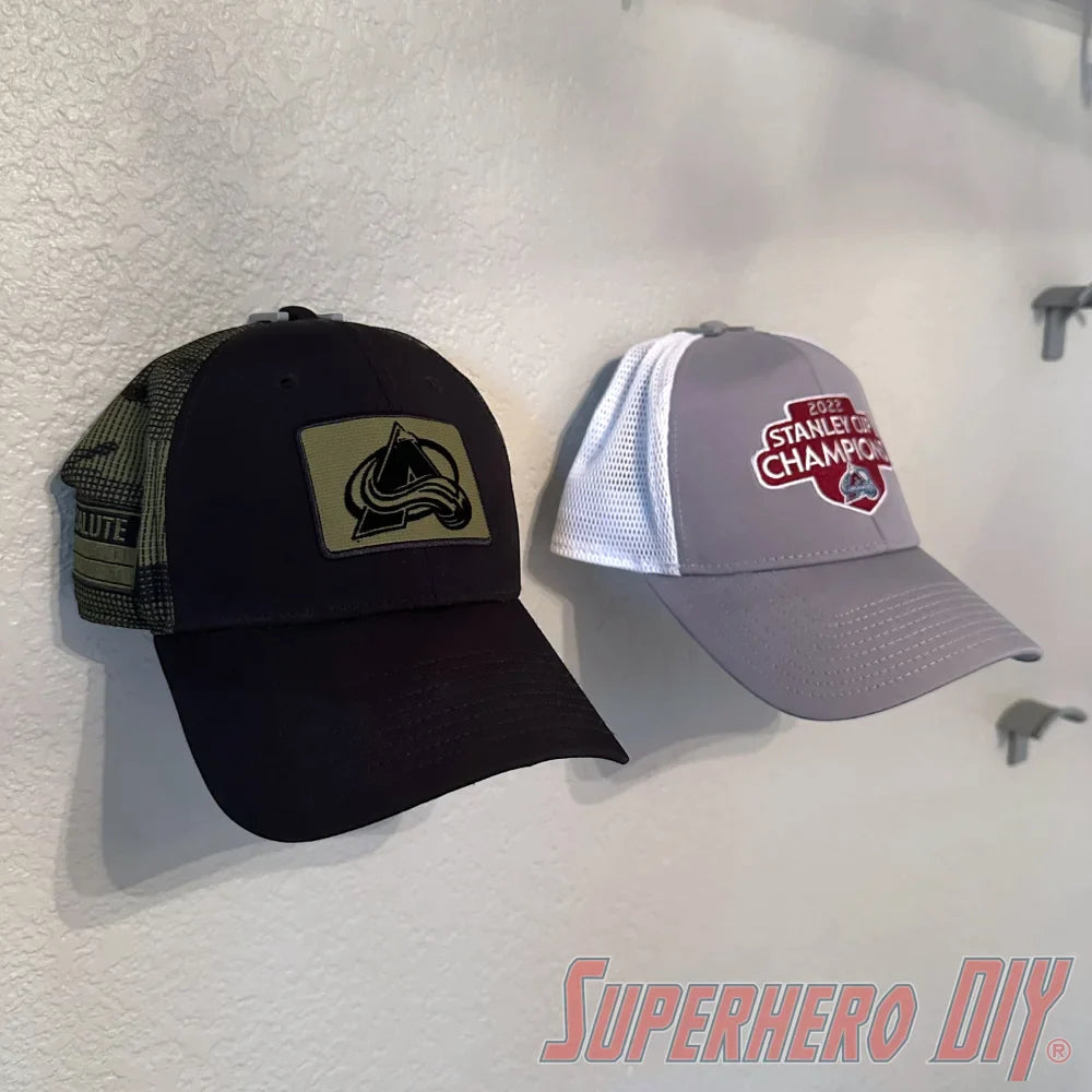 Check out the Hat Display Wall Mount | Hang your caps with ease using these wall hooks! from Superhero DIY! The perfect solution for only $1.99