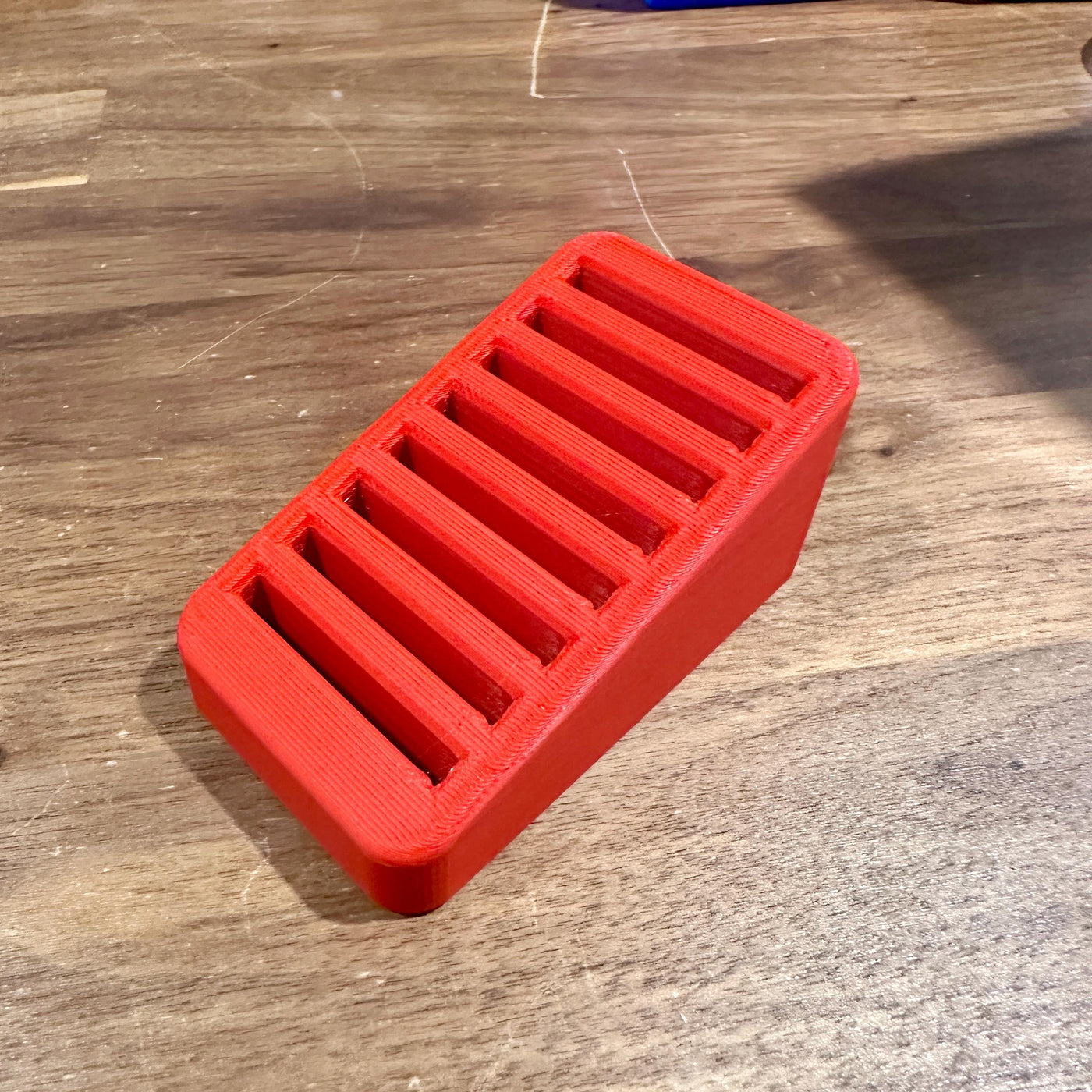 CFexpress Type B card organizer with 8 slots on wooden desk