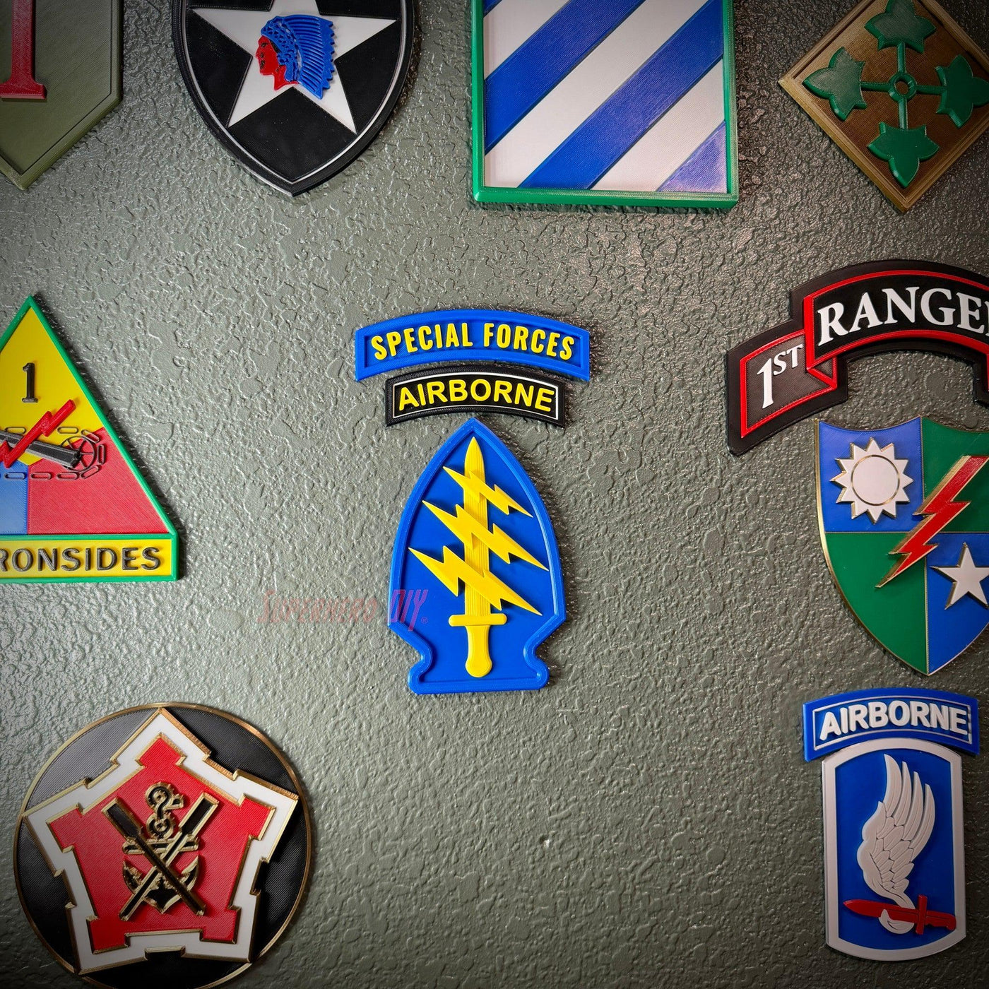 Special Forces display insignia featuring the arrowhead and Airborne tab on a wall display.