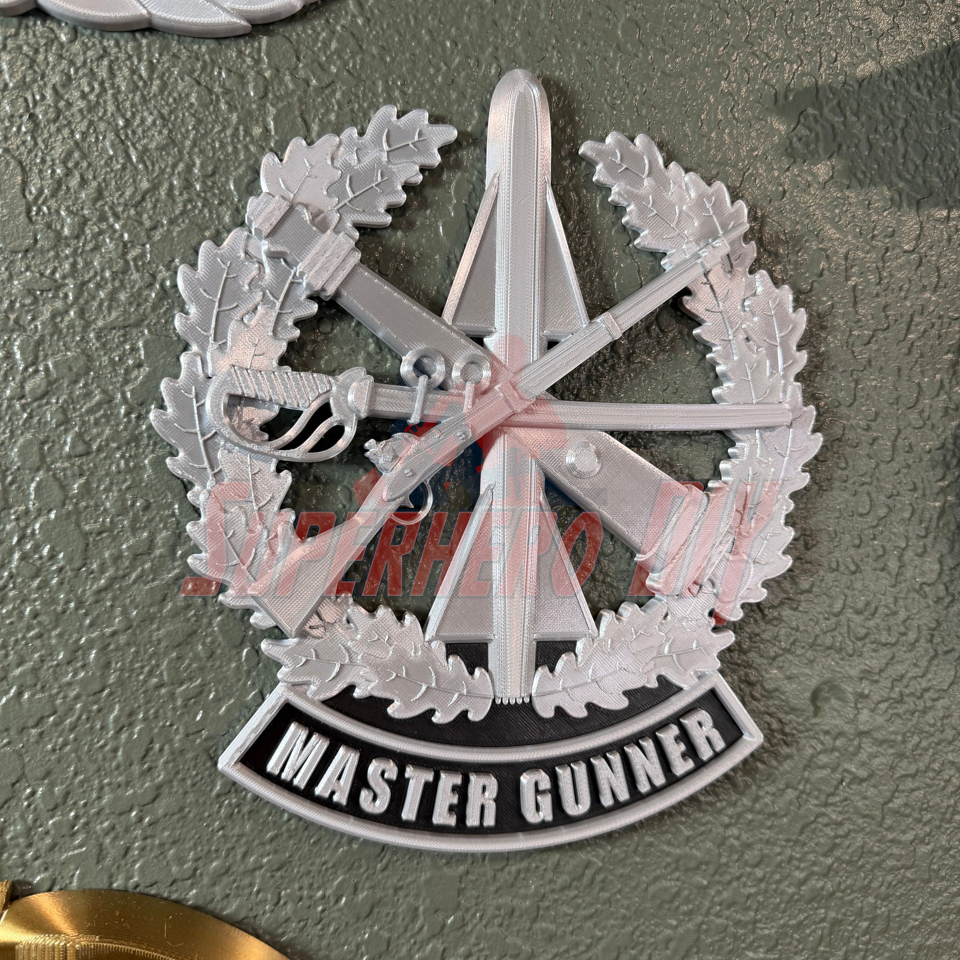 Master Gunner Badge display insignia in silver with detailed design, perfect for wall display or shadow box