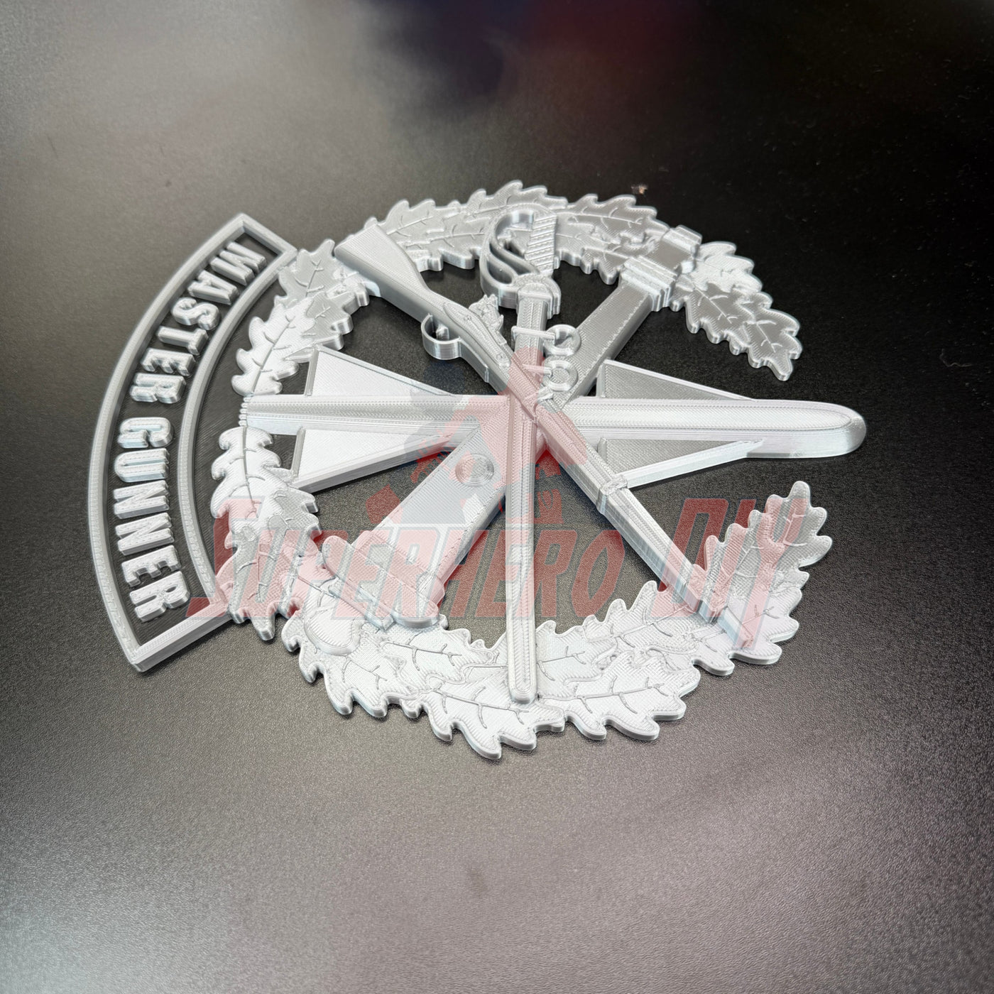 Master Gunner Badge display insignia 3D design featuring weapons and wreath, perfect for shadow box or wall.