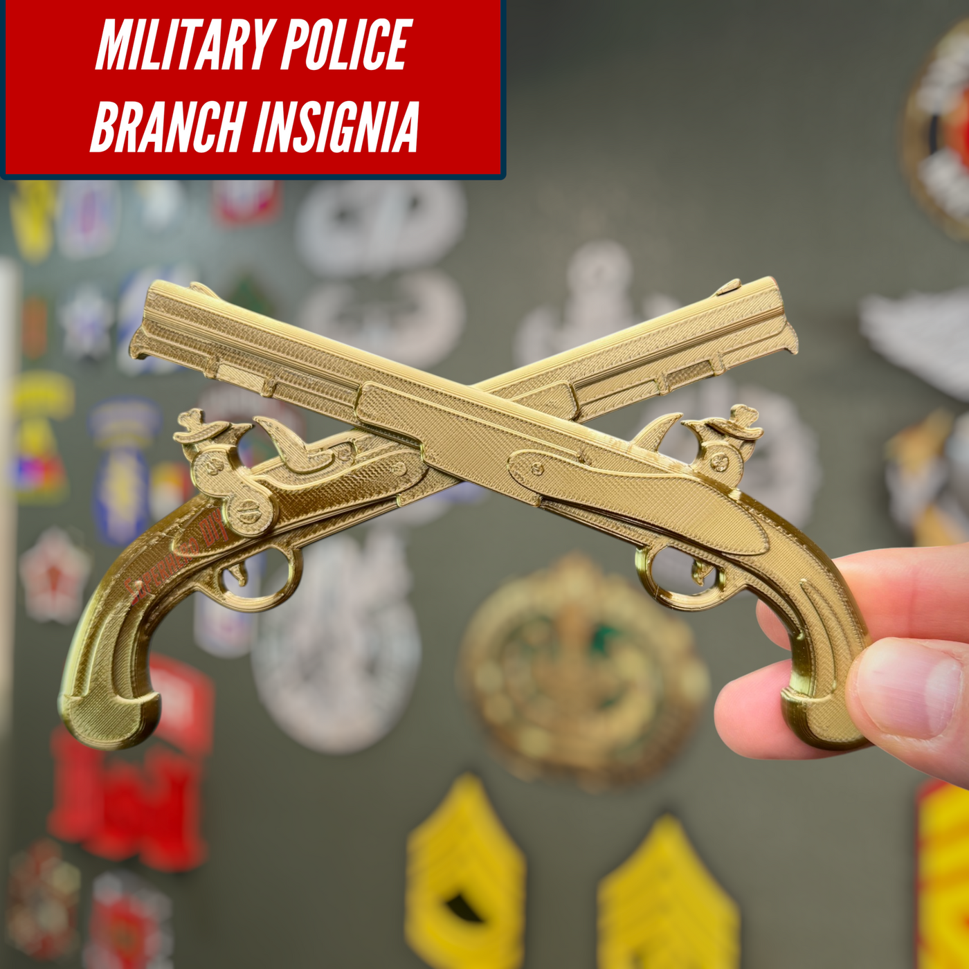 Army military police insignia displayed with golden crossed pistols on a wall of military patches.