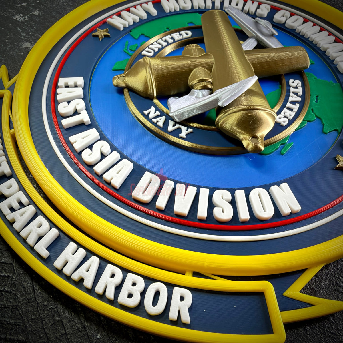 Navy Munitions Command Pacific insignia display with every color printed as its own raised layer